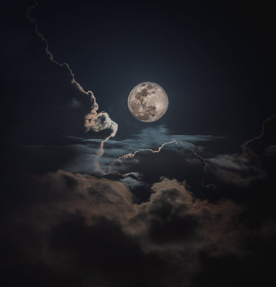 Full Moon Rising Above Dramatic Storm Clouds in a Dark Night Sky HD phone wallpaper