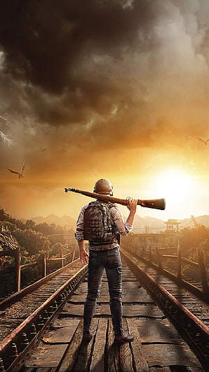PUBG Survivor Standing on Rusty Train Tracks with Sniper Rifle at Golden Hour HD phone wallpaper