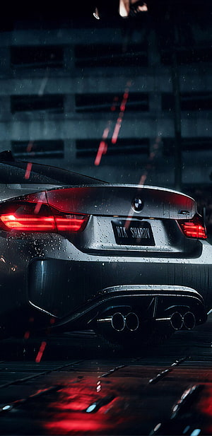 Rear View of a BMW M4 in the Rain with Glowing Red Taillights and Wet Asphalt Reflections HD phone wallpaper