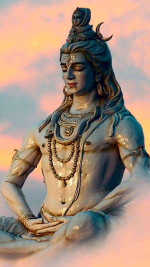 Lord Shiva Statue in Meditation with Serpents and Crescent Moon Against Sunset Sky HD phone wallpaper