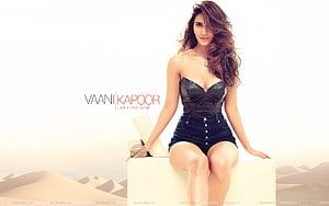 Vaani Kapoor in Black Corset and Denim Shorts Sitting on White Block HD wallpaper