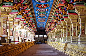 Ornate Pillared Corridor of a Traditional Tamil Temple in India HD wallpaper