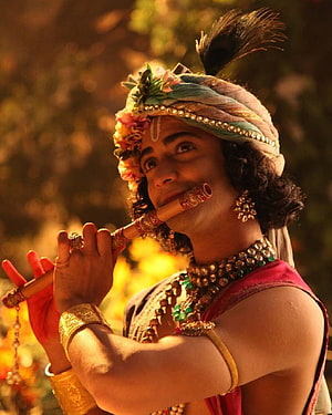 Radhe Krishna Character Playing Flute in Traditional Indian Attire HD phone wallpaper