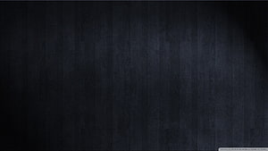 Dark Charcoal Wood Grain Texture with Subtle Vertical Planks and Moody Vignette HD wallpaper