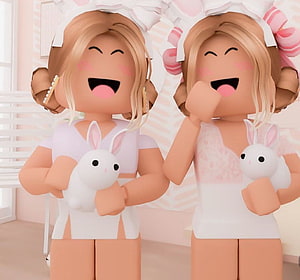 Two Roblox Avatars in White Bunny Outfits Holding Plush Toys in a Pastel Room HD wallpaper