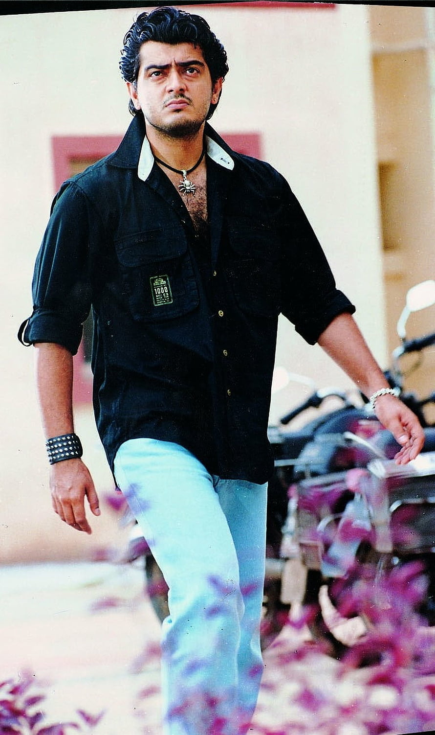 Ajith Kumar in Black Shirt and Light Denim Jeans Walking Through Petals HD phone wallpaper