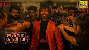Jagame Thanthiram Movie Still Featuring Dhanush in Red Suit Surrounded by Guns HD wallpaper