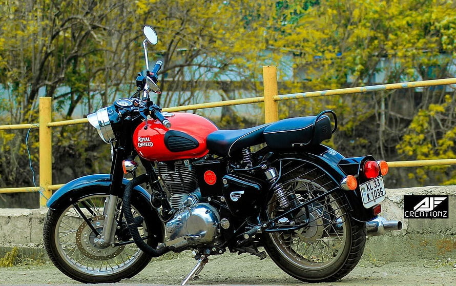 Red Royal Enfield Classic 350 Motorcycle Parked on a Gravel Road HD wallpaper