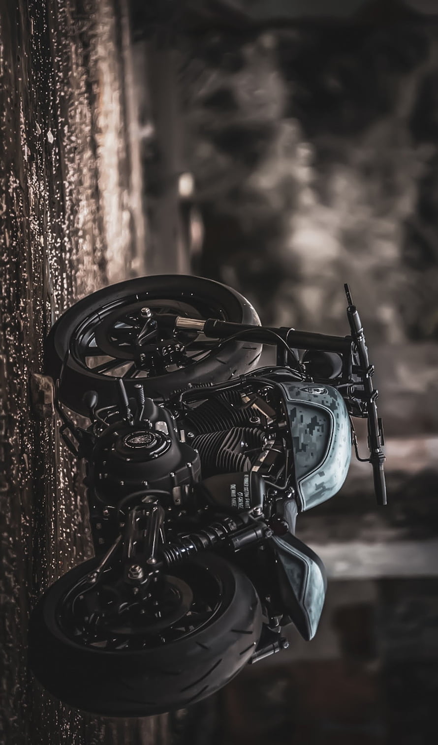 Custom Camo Bobber Motorcycle Parked on Wet Cobblestone Street at Night HD phone wallpaper