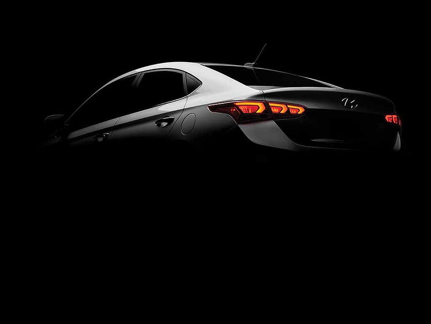 2017 Hyundai Verna Sedan Rear Three-Quarter View in Dramatic Black Background HD wallpaper