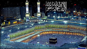 Aerial Night View of the Grand Mosque in Mecca with the Kaaba and Massive Pilgrim Crowds HD wallpaper