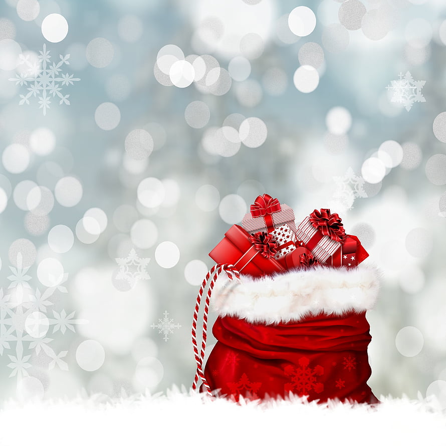 Red Christmas sack overflowing with wrapped gifts and bows against a snowy bokeh background HD wallpaper