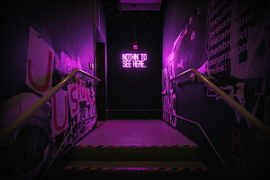 Dark Urban Stairwell With Purple Neon Sign And Street Art Walls HD wallpaper