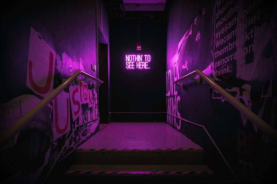 Dark Urban Stairwell With Purple Neon Sign And Street Art Walls HD wallpaper
