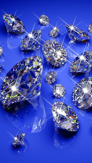 Sparkling Faceted Diamonds Scattered on a Vibrant Blue Surface with Starburst Flares HD phone wallpaper