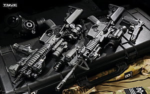 Tactical Assault Rifles and Military Gear Arranged on Black Case HD wallpaper