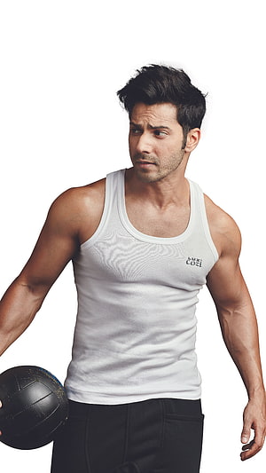 Varun Dhawan in White Tank Top Holding Black Volleyball HD phone wallpaper