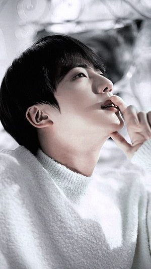 Jin from BTS in a white turtleneck sweater with a soft, dreamy expression HD phone wallpaper