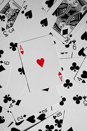 Scattered Bicycle Playing Cards with Ace of Hearts Centered on White Background HD phone wallpaper