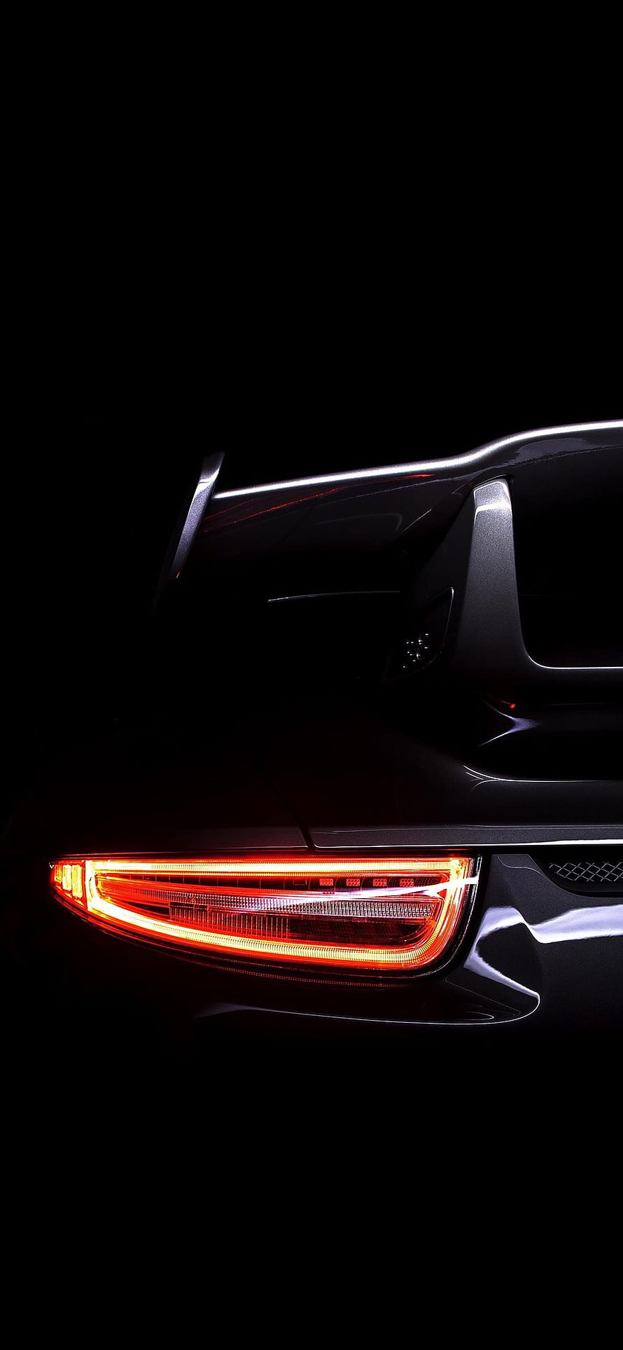 Porsche GT3 Rear Taillight and Spoiler Detail in Dark Studio Lighting HD phone wallpaper