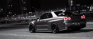 Nissan Skyline GT-R R34 Night Cityscape Rear Three-Quarter View HD wallpaper