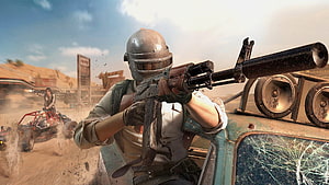 PUBG Mobile Desert Combat Scene with Armored Soldier and Off-Road Vehicle HD wallpaper