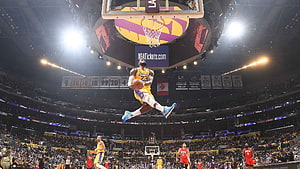 LeBron James Mid-Air Dunk at Los Angeles Lakers Home Court HD wallpaper
