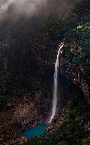 Misty Waterfall Plunging into Turquoise Pool in Meghalaya, India HD phone wallpaper