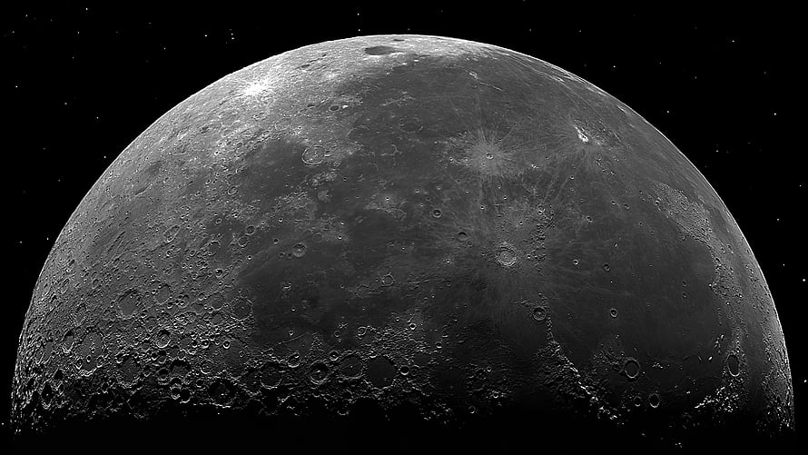 High-Resolution Black and White Close-Up of the Moon's Cratered Surface Against a Starry Night Sky HD wallpaper