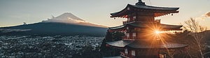 Mount Fuji and Chureito Pagoda at Golden Hour with Snow-Capped Peak and Cityscape HD wallpaper
