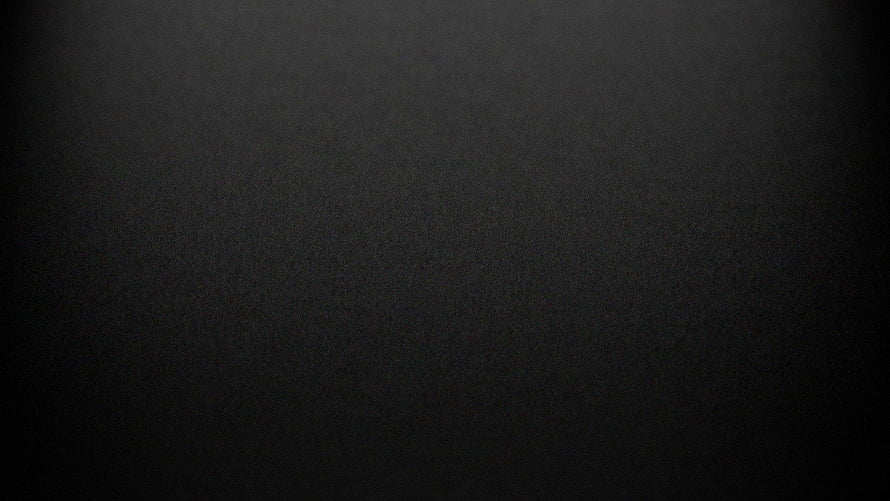 Minimalist Dark Grey Textured Surface with Subtle Vignette and Matte Finish HD wallpaper