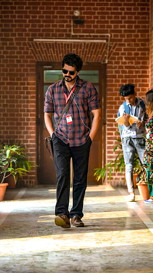 Vijay Sethupathi in Master Walking Through Brick Corridor with Sunglasses and Plaid Shirt HD phone wallpaper