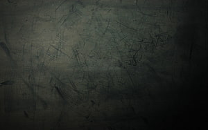 Dark scratched metal surface with gritty industrial texture and moody abstract background HD wallpaper