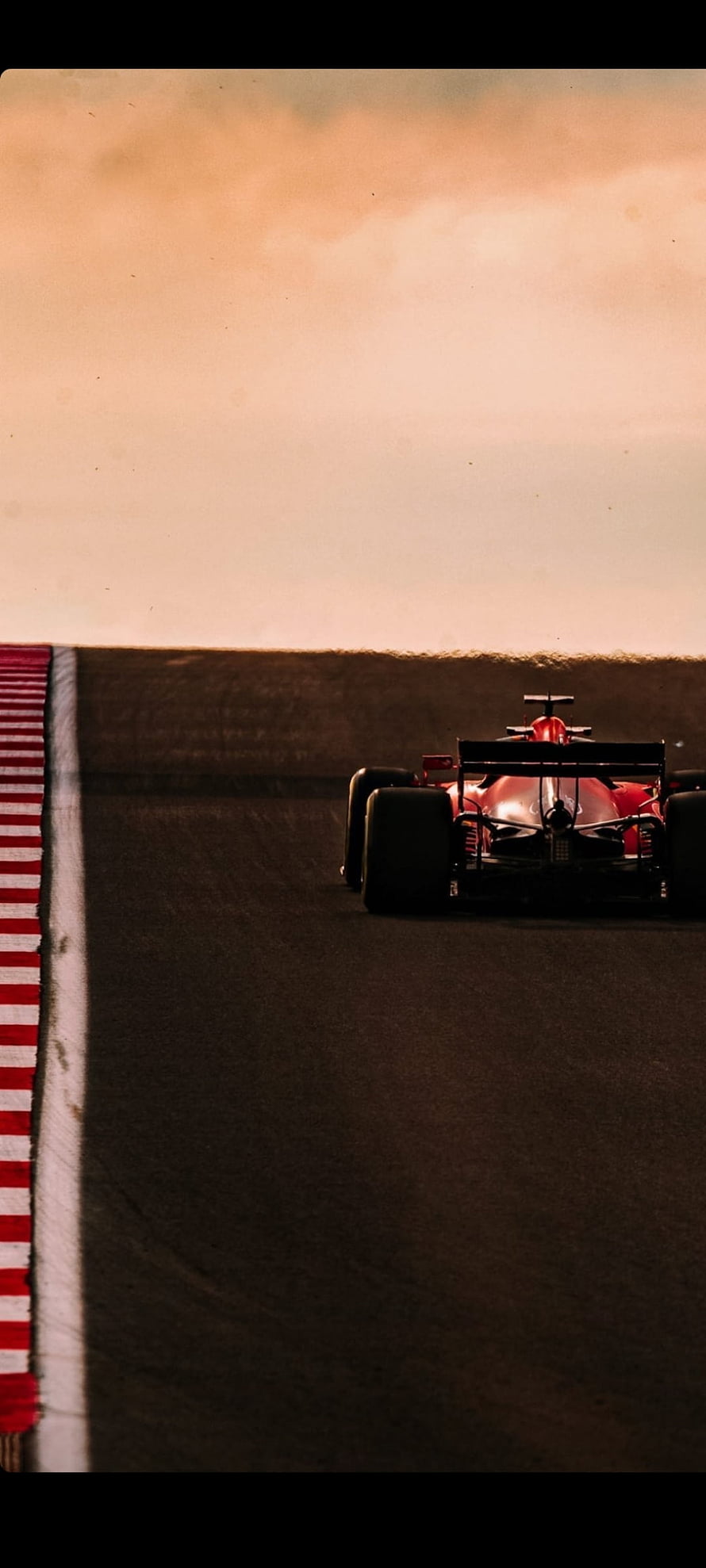 Charles Leclerc Scuderia Ferrari Formula 1 Car on the Race Track at Sunset HD phone wallpaper