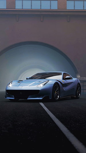 Blue Ferrari Supercar Parked in a Concrete Tunnel with Dramatic Lighting HD phone wallpaper
