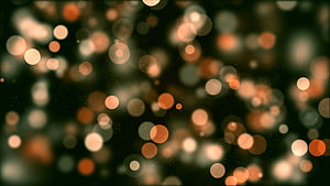 Warm Amber Bokeh Light Orbs Against Dark Background HD wallpaper