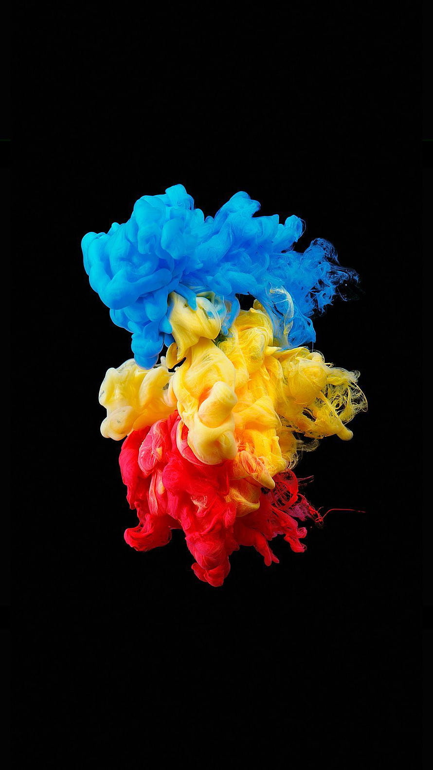 Vibrant Blue Yellow and Red Ink Clouds Diffusing in Water Against Black Background HD phone wallpaper