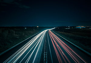 Long Exposure Highway at Night with Streaking Headlights and Taillights HD wallpaper