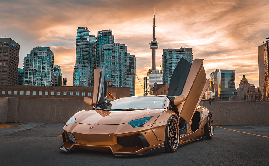 Golden Lamborghini Aventador with Scissor Doors Parked in Toronto at Sunset HD wallpaper
