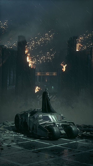 Batman Standing Beside Batmobile in Rainy Destroyed Cityscape at Night HD phone wallpaper