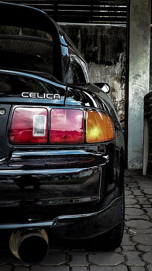 Rear Quarter View of a Black Toyota Celica GT4 with Glossy Paint and Dual Exhaust HD phone wallpaper