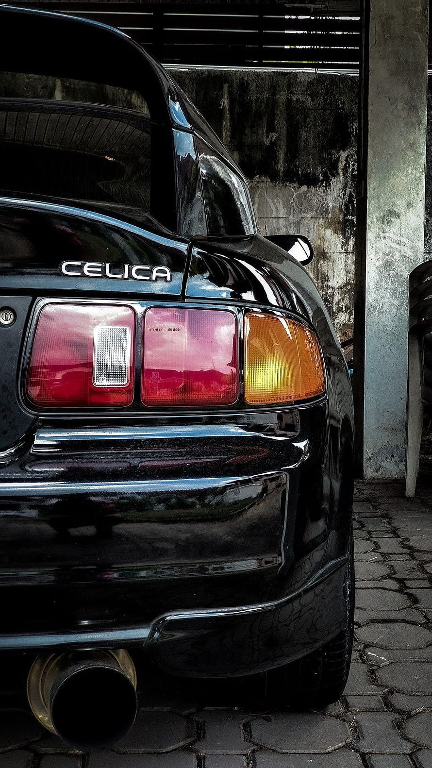 Rear Quarter View of a Black Toyota Celica GT4 with Glossy Paint and Dual Exhaust HD phone wallpaper
