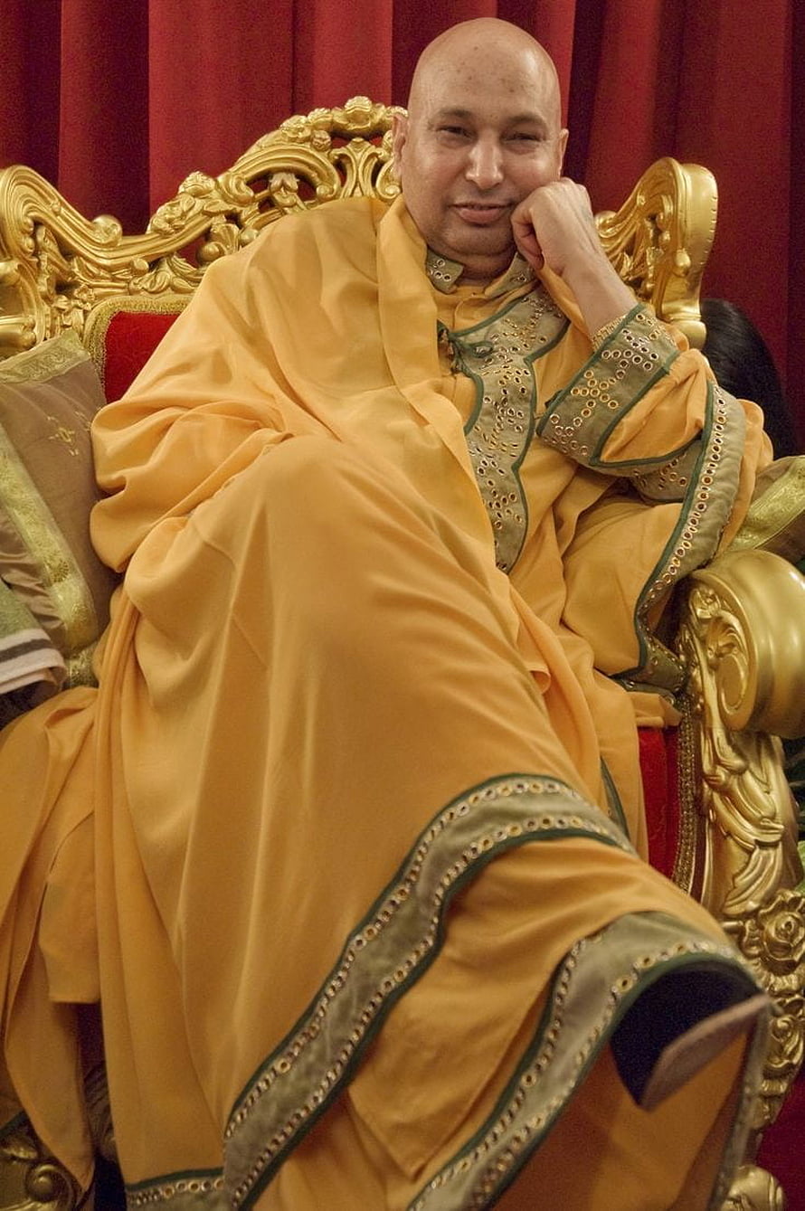 Mohit Saev in Traditional Yellow Attire Seated on Ornate Golden Throne HD phone wallpaper