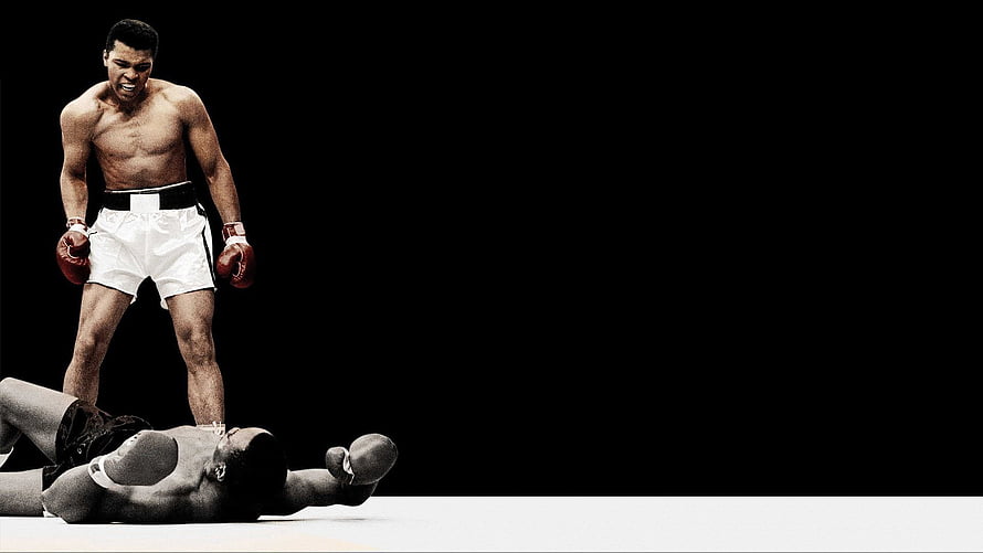 Muhammad Ali Standing Over Knocked Out Opponent in Dramatic Boxing Ring Scene HD wallpaper