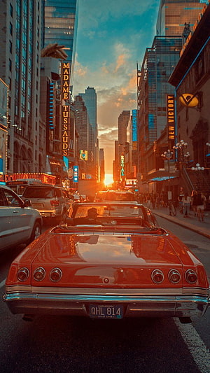 Vintage Red Convertible on Broadway at Sunset with Madame Tussauds and New York City Skyline HD phone wallpaper