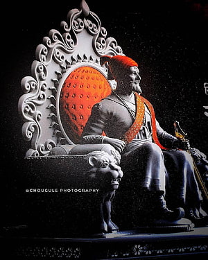Shivaji Maharaj Seated on Ornate Throne with Lion Pedestal and Red Turban HD phone wallpaper