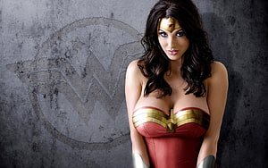 Wonder Woman in Classic Red and Gold Costume Against Textured Concrete Wall HD wallpaper