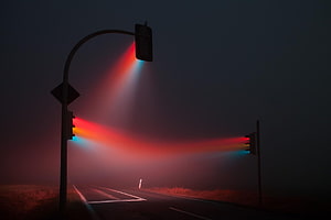 Glowing Traffic Signals Cutting Through Thick Night Fog on a Dark Road HD wallpaper