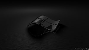 Sleek Black Metallic Windows Logo on Dark Reflective Surface HD wallpaper