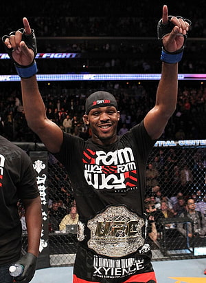 Jon Jones Celebrates UFC Championship Victory in the Octagon HD phone wallpaper